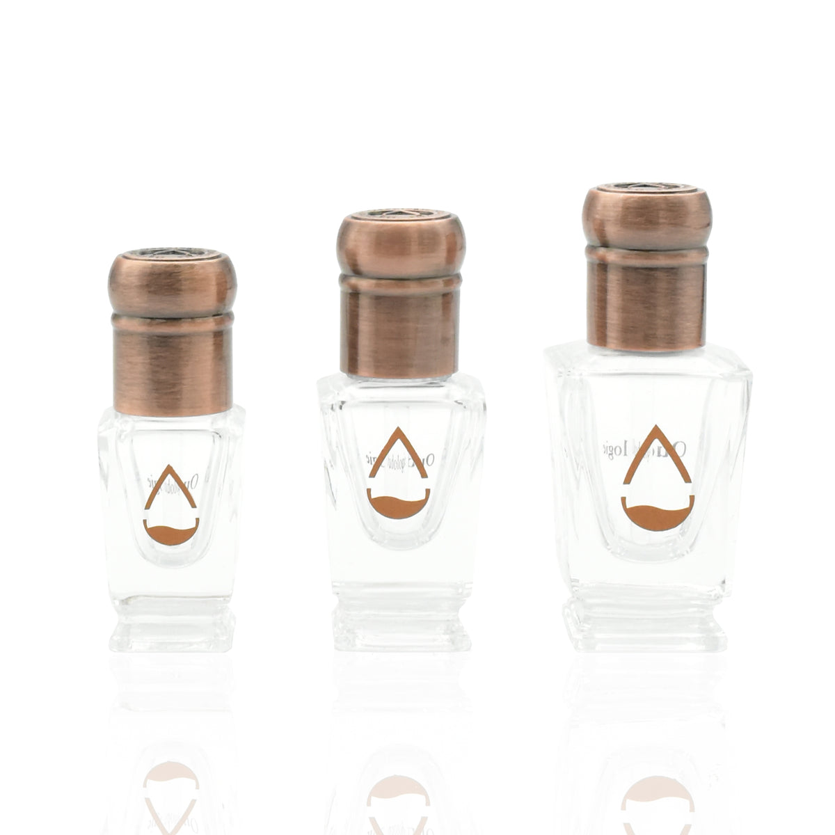 Three sizes of Oudologie oud oil bottles with antique bronze caps displayed on a white background.