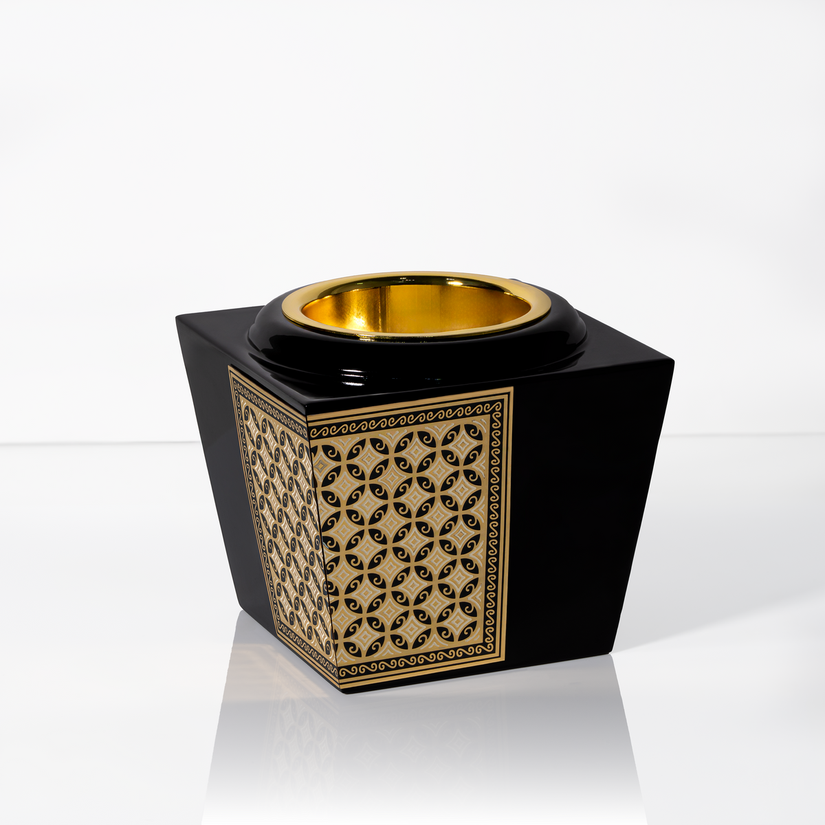Black and gold bakhoor burner with an ornate metal design and gold incense chamber, suitable for burning oud chips, bakhoor and incense.
