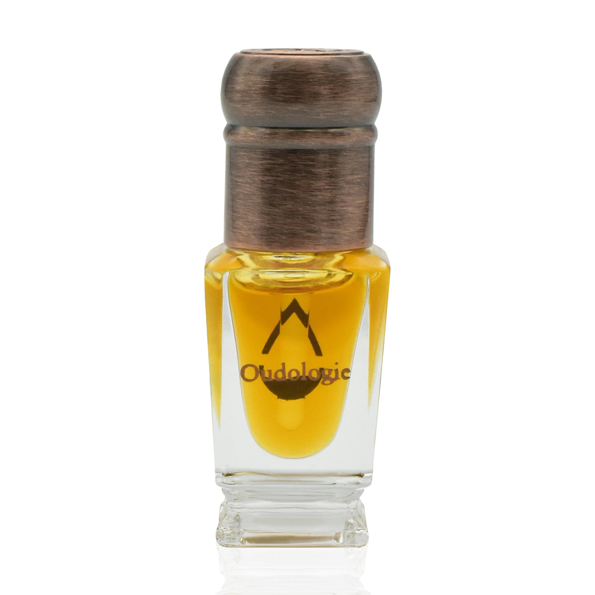 Oudologie pure oud oil in a clear glass bottle with golden oil and an antique bronze cap.